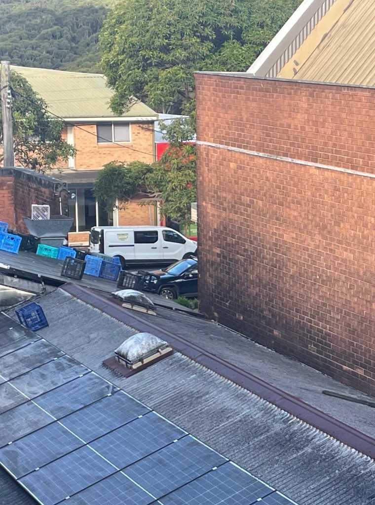 Elevated view of the Community Hall north-east corner beside Gibbons Lane and adjacent buildings